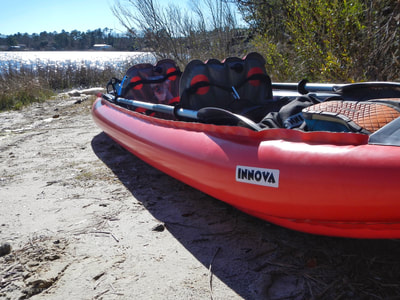 Launching an inflatable Innova kayak from the Queens Creek Road bridge