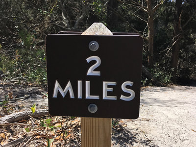 Mile marker on the seaside Elliot Coues Nature Trail.