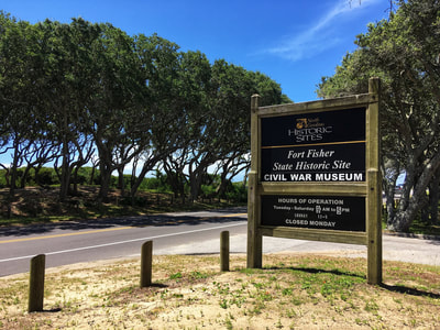 The entrance sign to the Fort Fisher State Park visitor's center.
