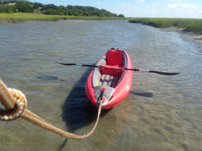 Pulling our kayak at low tide on the paddle route to Bear Island, North Carolina