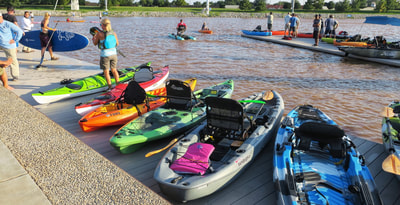 Kayaks along the river at demo day at this year's Paddlesports Retailer Show.