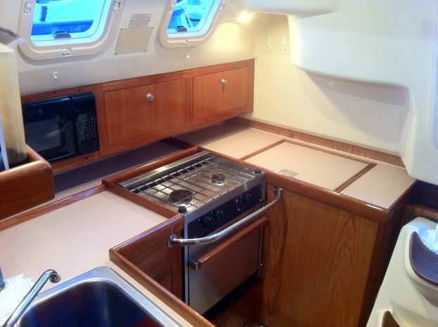 A newly cleaned galley aboard our new liveaboard sailboat Kingsley.