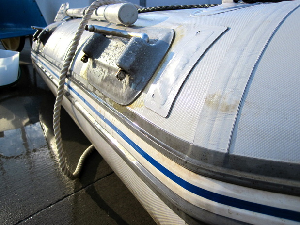 Cleaning our liveaboard sailboat dinghy.