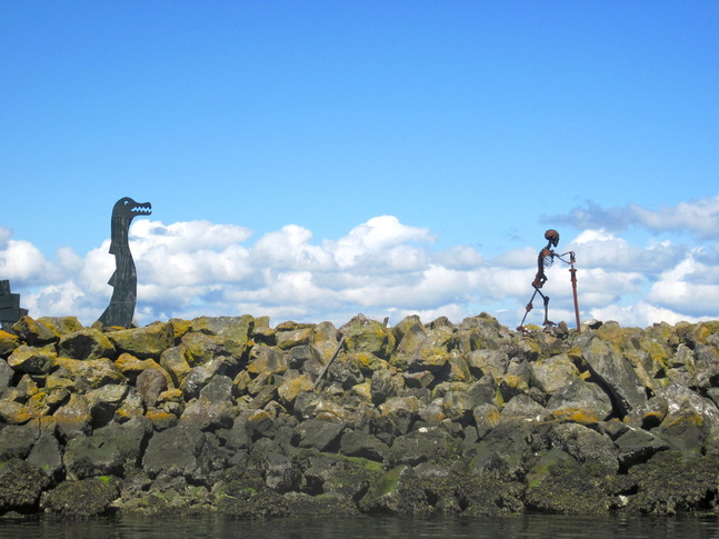 The Sea Serpent and Dead Leif sculpture on the breakwater at Shilshole Marina