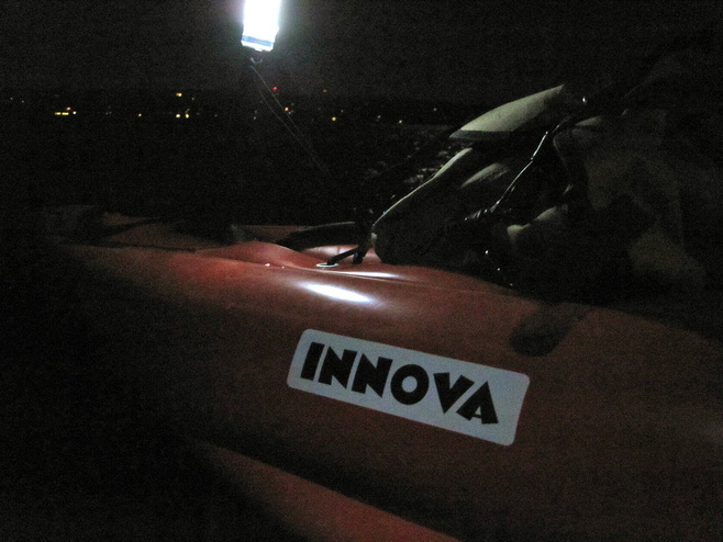 Our Innova Safari under light during a night paddle