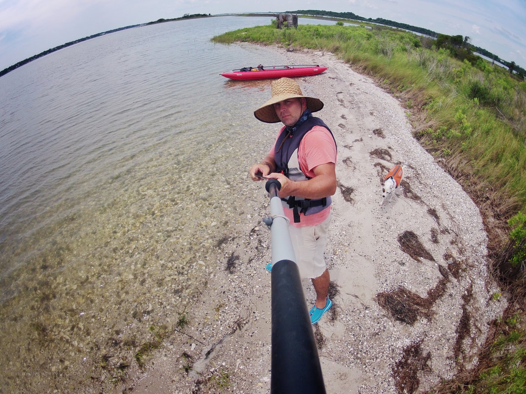 Gorpo selfie time with dog while kayaking near Emerald Isle.