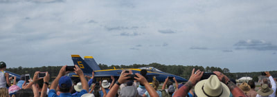 A blue angel passing the crowd at the 2018 MCAS Cherry Point air show