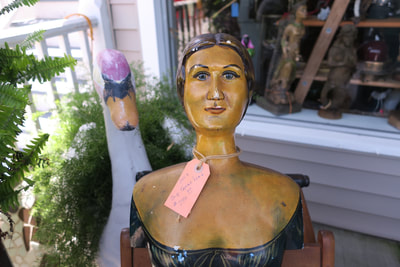A mermaid outside of the Poor Man's Hole shop in downtown Swansboro