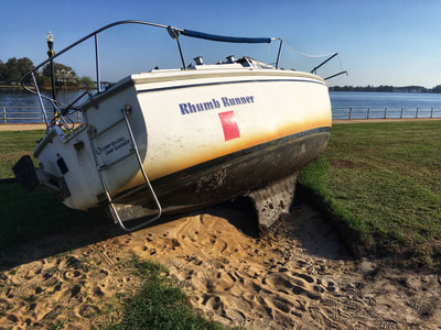 A broken sailboat beached in downtown New Bern, NC following hurricane Florence